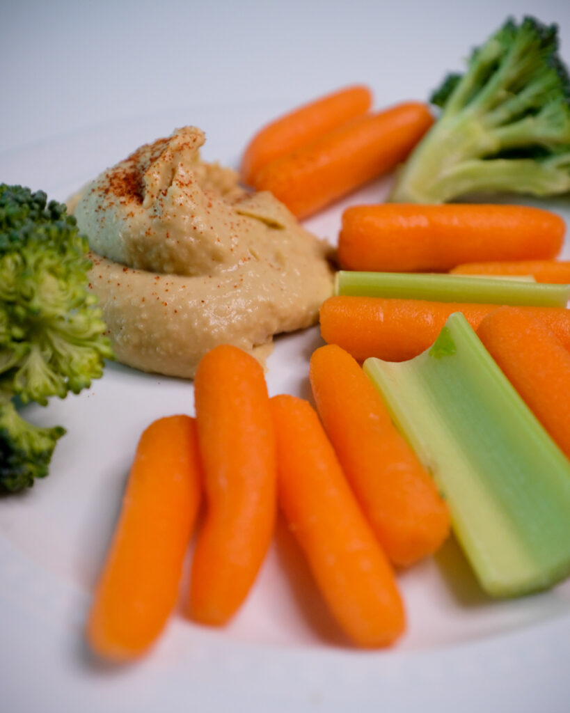 hummus with carrots as healthy snacks when junk food cravings hit